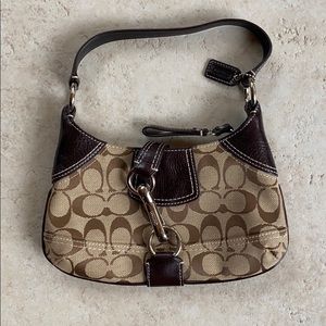 New without tags Coach hand purse.